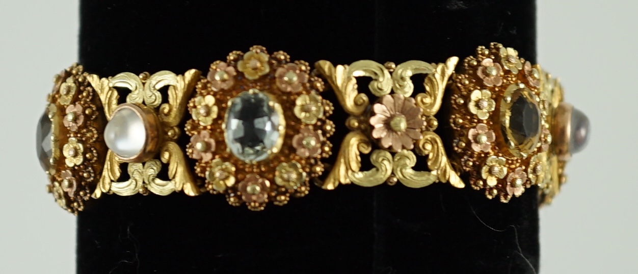A 19th century pierced three colour gold, pink topaz, moonstone, citrine and aquamarine set bracelet.